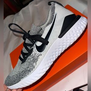 Black/White/Gray Nike Free Run running sneakers